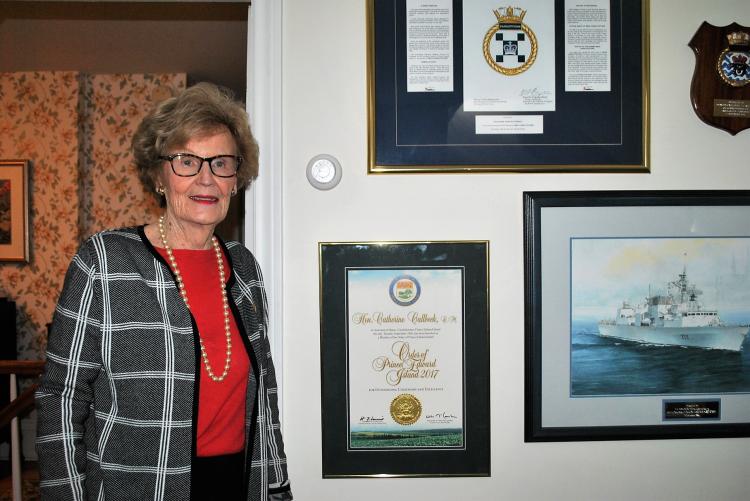 Catherine Callbeck stands at a wall of memorabilia in her home